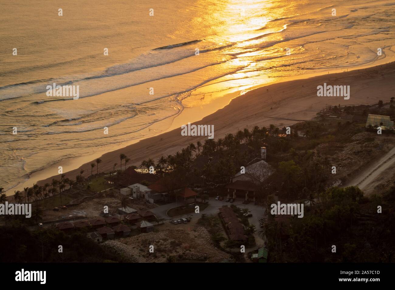 Yogyakarta, Indonesia. 18th Oct, 2019. An aerial view of Parangtritis Beach Yogyakarta at Watugupit Paragliding Hill during sunset.Watugupit Paragliding Hill is the best spot to watch the sunset with a view of Parangtritis Beach in Yogyakarta. Credit: Algi Febri Sugita/SOPA Images/ZUMA Wire/Alamy Live News Stock Photo