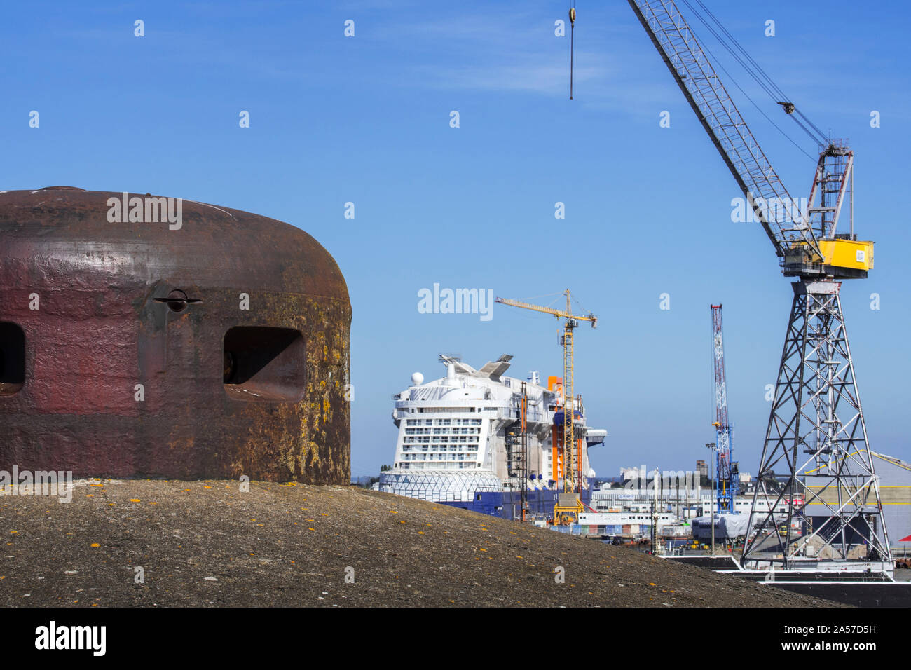 Steel turret from the German WW2 Kriegsmarine submarine base looking over the shipyard in the port of Saint-Nazaire, Loire-Atlantique, France Stock Photo