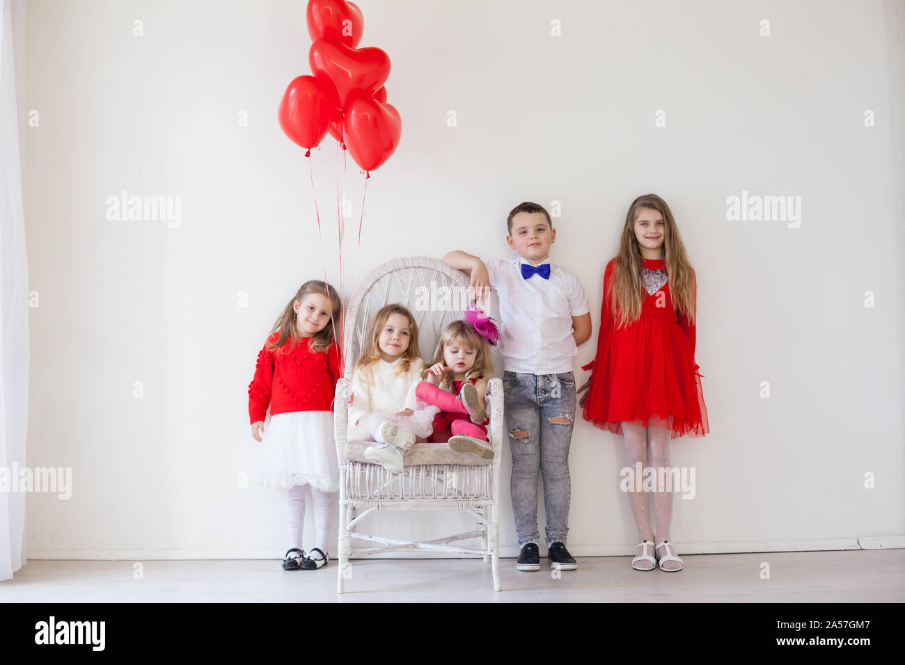 Three Girls And A Boy With Balloons On Valentine S Day Stock Photo Alamy