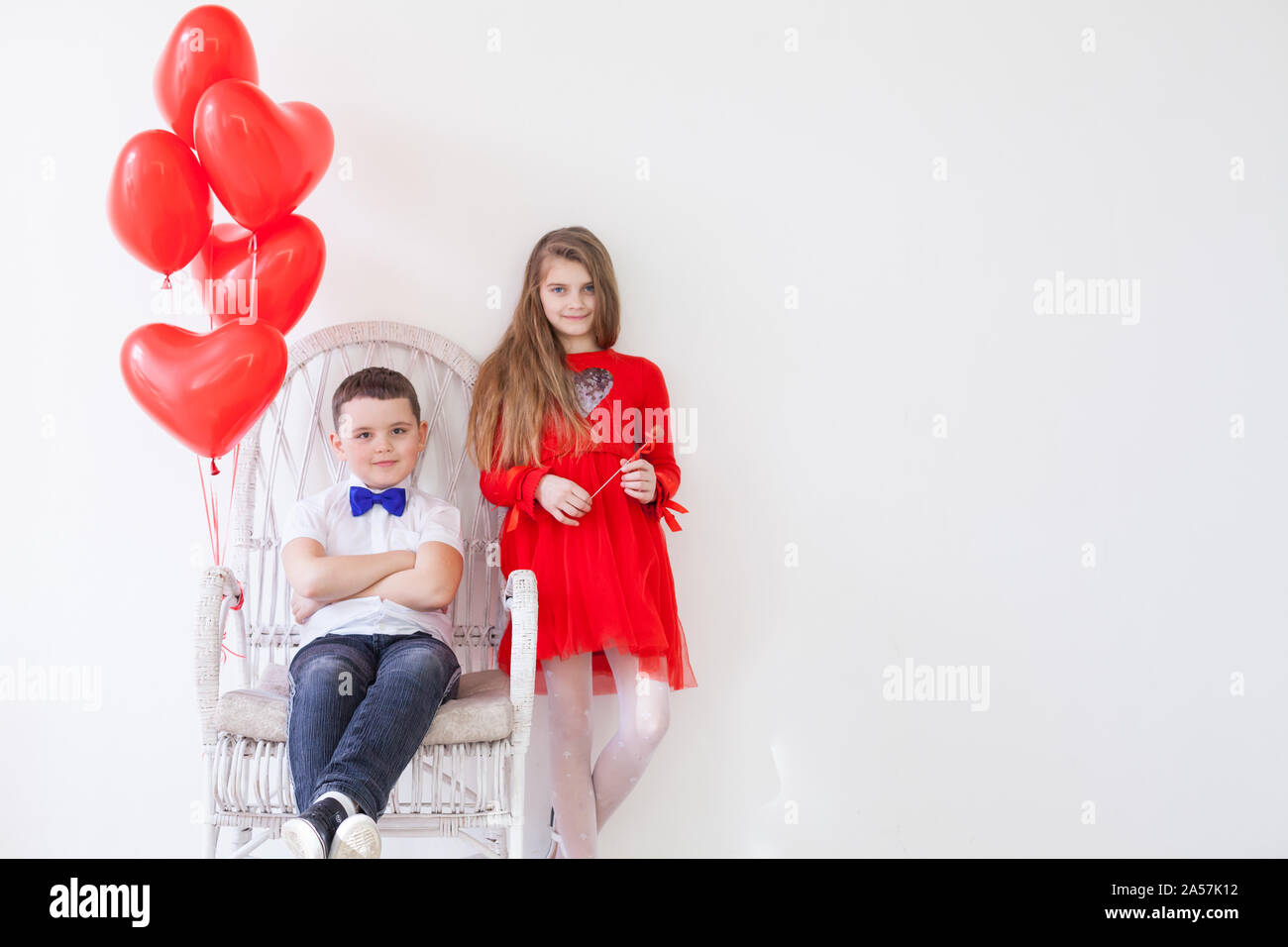 Girl and boy with balloons on Valentine's Day Stock Photo Alamy