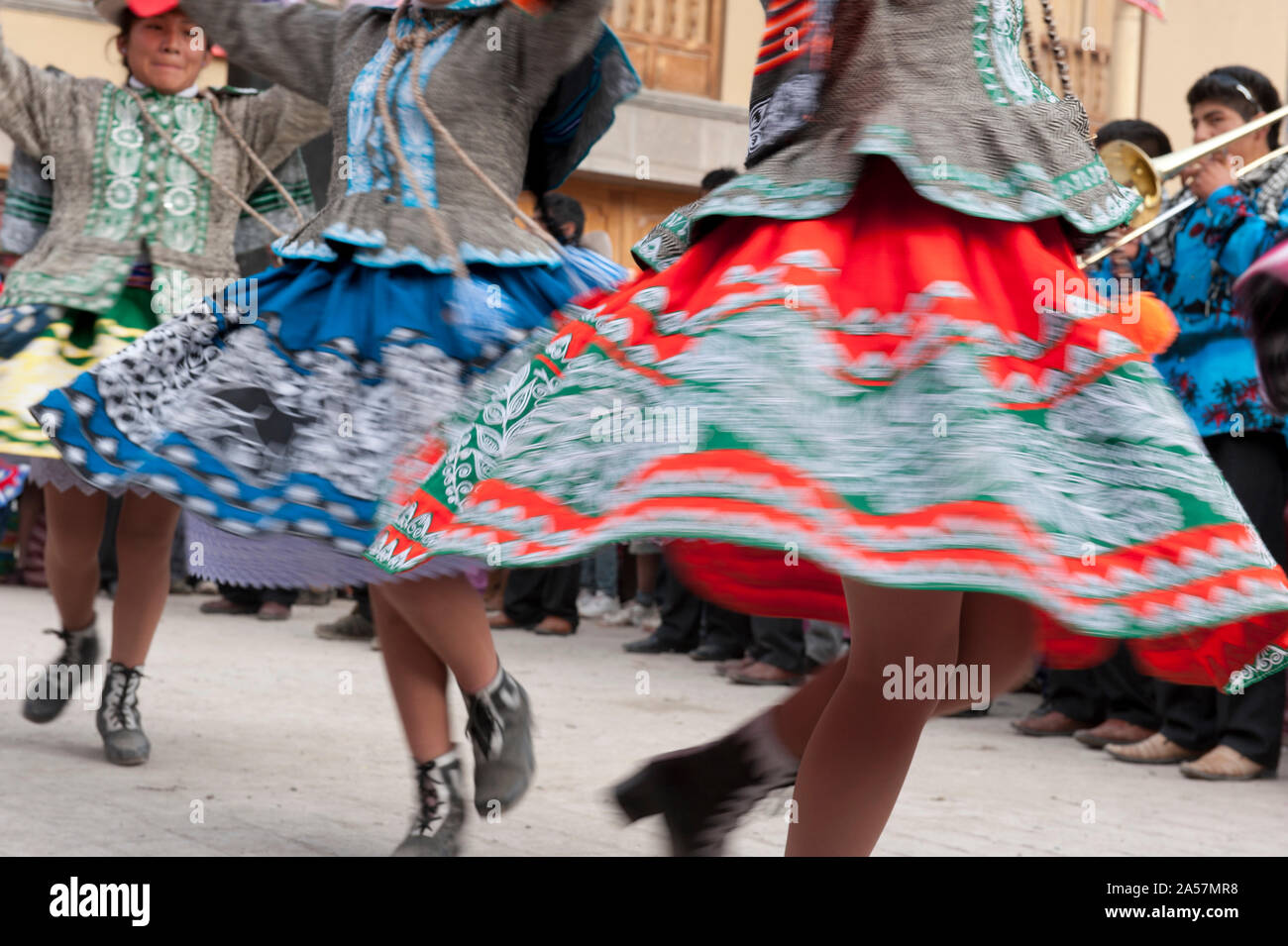 Women dancing during Pentecost celebration at town square, Ollantaytambo, Urubamba Province, Cusco Region, Peru Stock Photo
