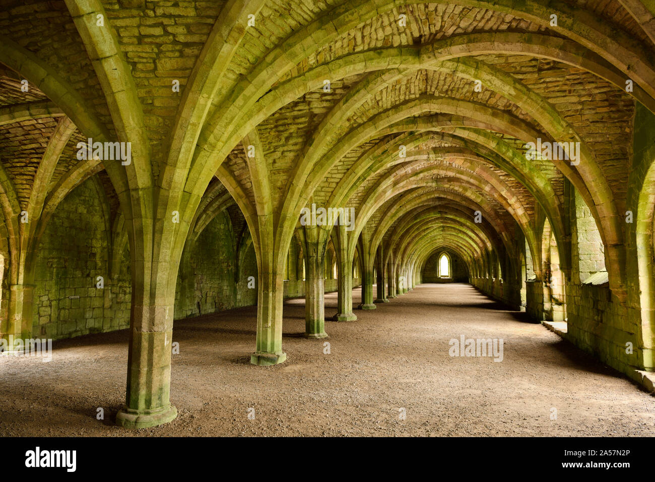 Fountains Abbey Cistercian monastery ruins vaulted stone arch ceiling
