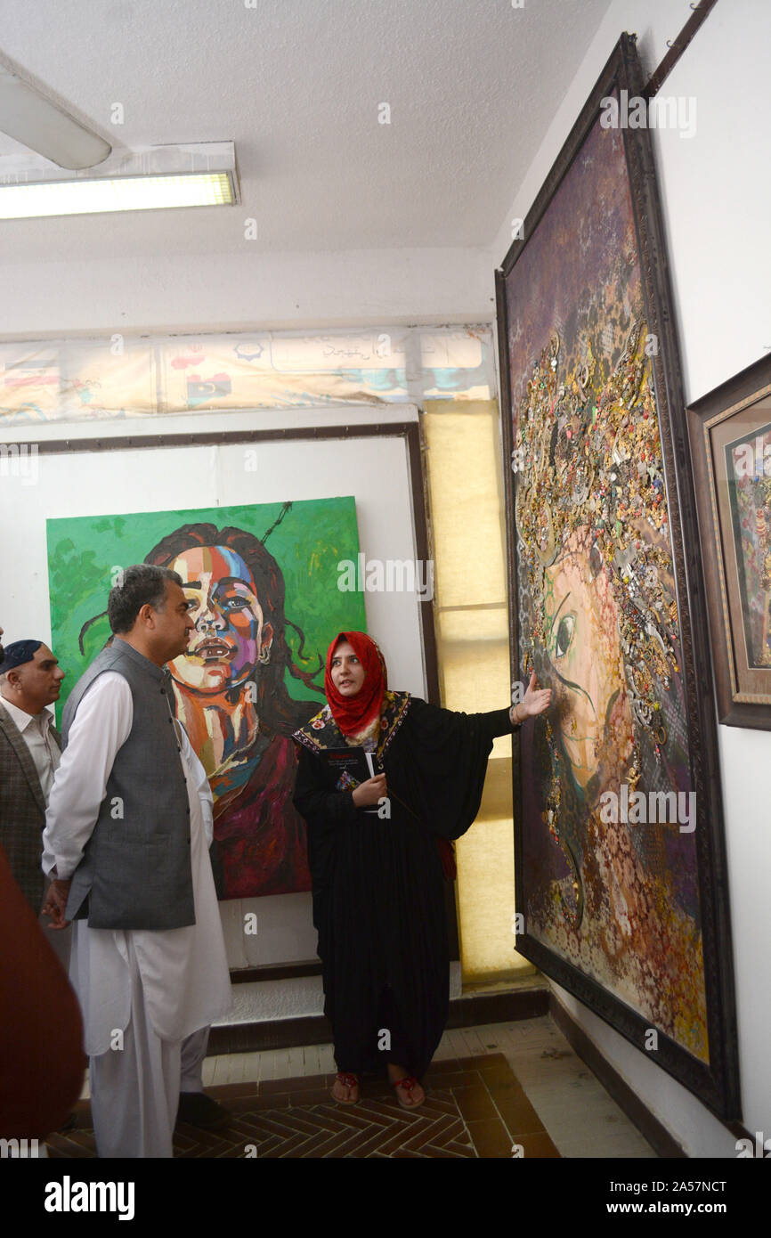 Quetta, Pakistan. 18th Oct, 2019. Fine Art student giving briefing to the Secretary of culture, tourism and archive department Mr. Zafar Ali Buledi, Khudai Raheem and other about her art during women expressionism painting exhibition at Art Council Balochistan organized by culture, tourism and archive department government of Balochistan. (Photo by Din Muhammad Watanpaal/Pacific Press) Credit: Pacific Press Agency/Alamy Live News Stock Photo