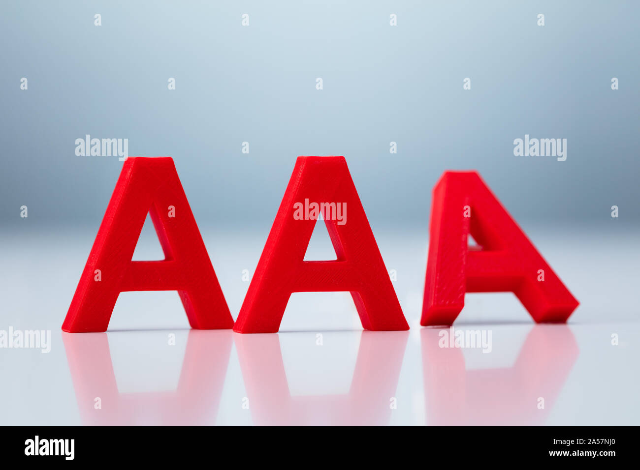 Credit Rating Decrease From AAA to AA Concept Stock Photo