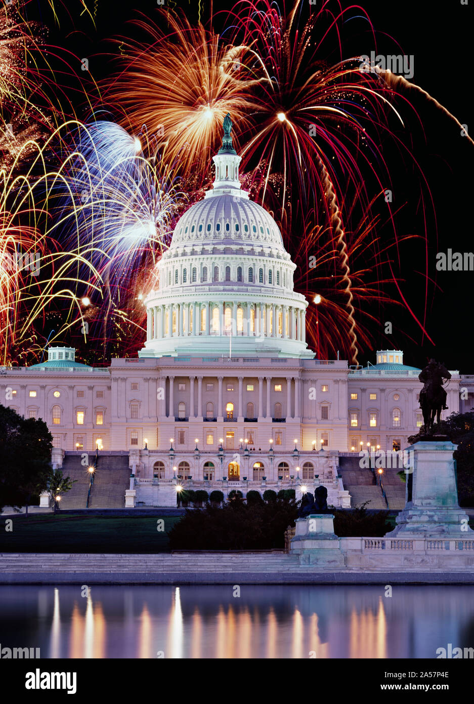 Digital Composite, Firework display over a government building at night, Capitol Building, Capitol Hill, Washington DC, USA Stock Photo