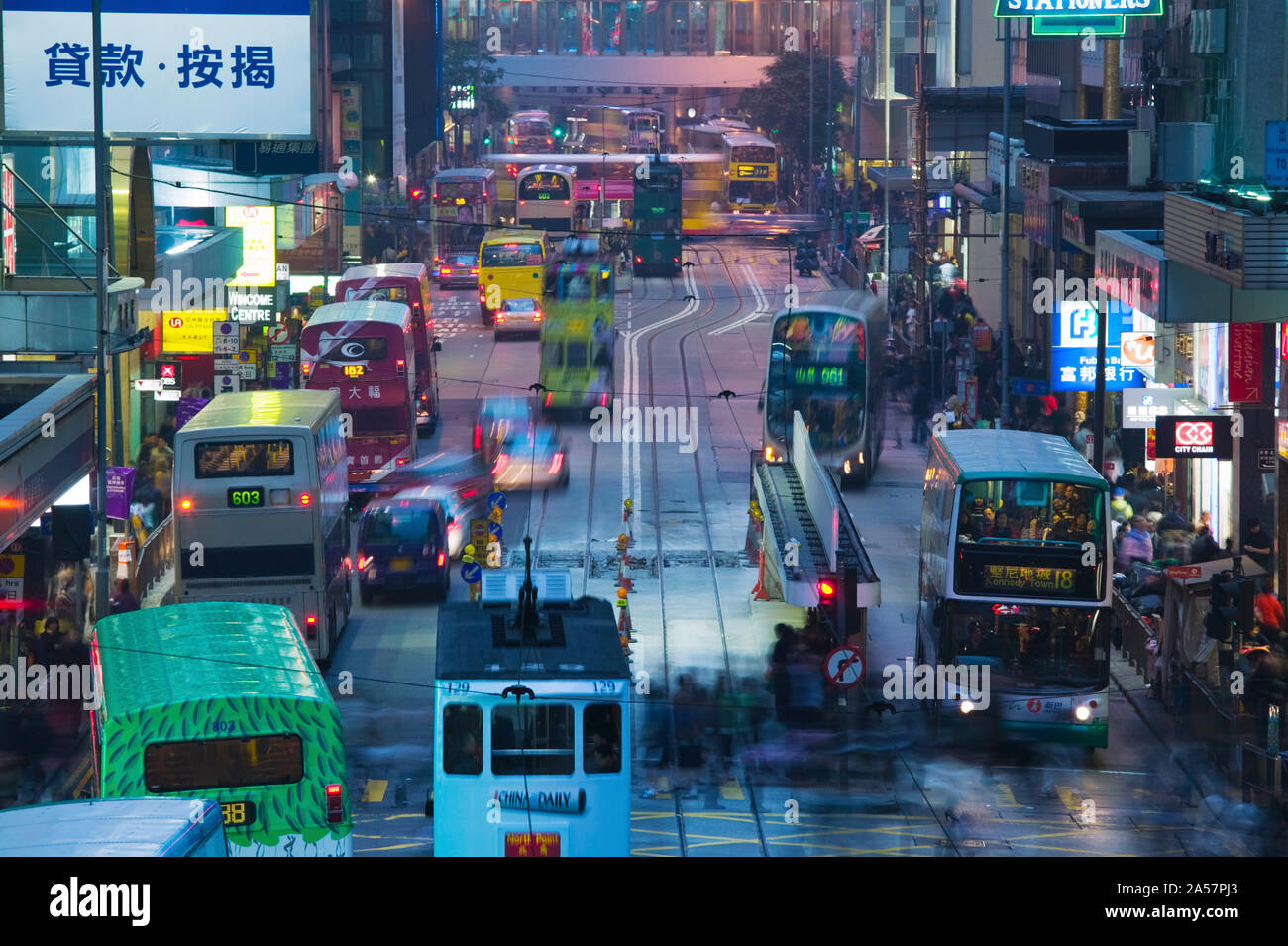 Traffic on a street at night, Des Voeux Road Central, Central District, Hong Kong Island, Hong Kong Stock Photo