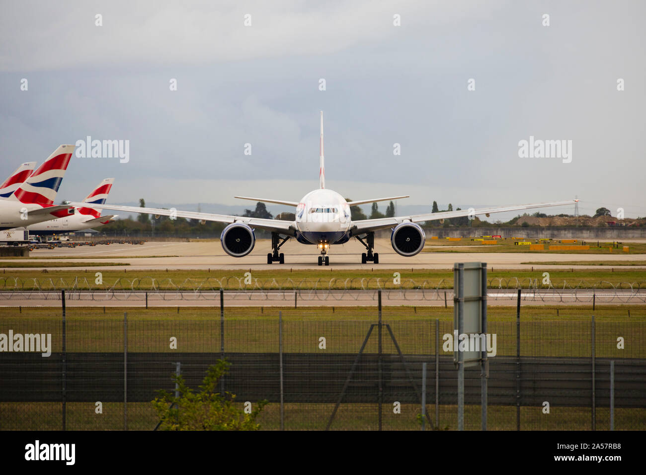British Airways Boeing 777-236 airliner taking off from London Heathrow Airport. England. October 2019 Stock Photo