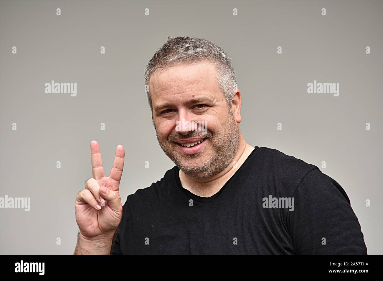 An Overweight Man And Peace Sign Stock Photo - Alamy