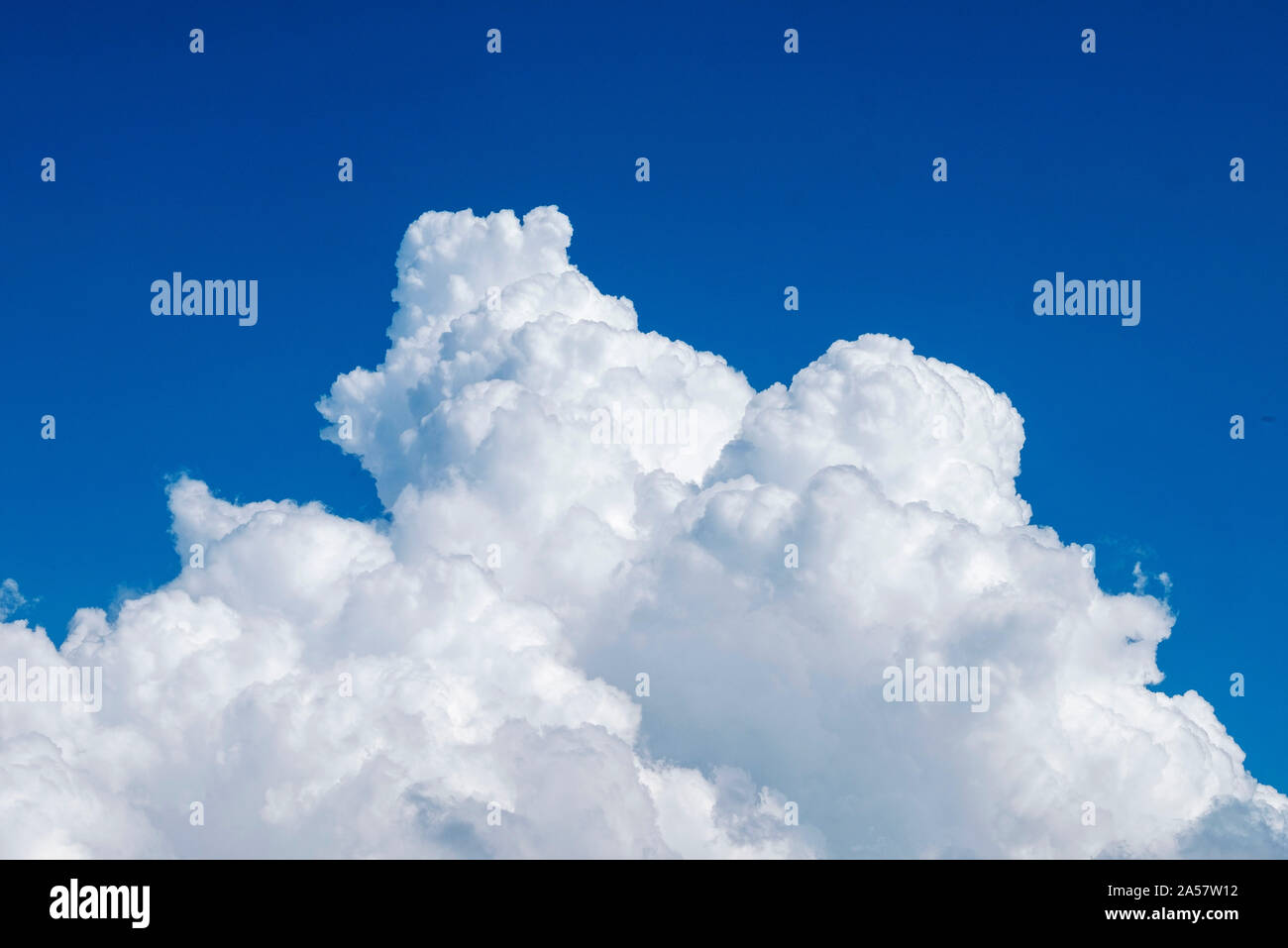 White fluffy Cumulonimbus clouds against a blue sky, Paphos, Cyprus. Stock Photo