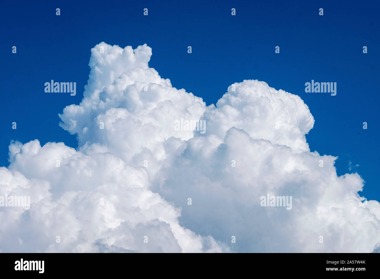 White fluffy Cumulonimbus clouds against a blue sky, Paphos, Cyprus. Stock Photo