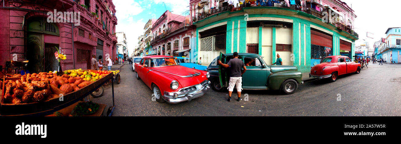 360 degree view of old cars and fruit stand on a street, Havana, Cuba Stock Photo