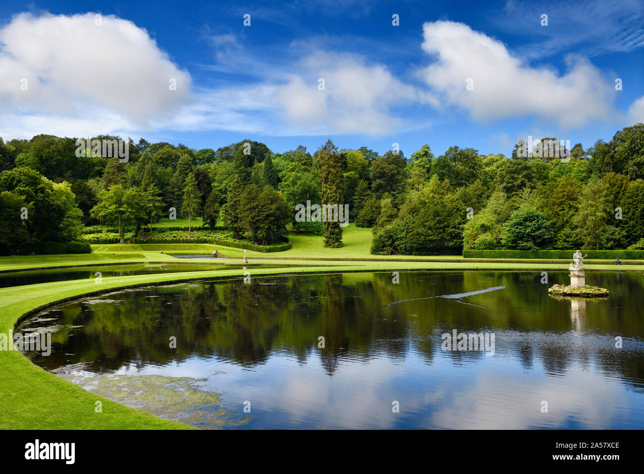 Studley Royal Water Garden Moon Pond with Neptune sculpture on the River Skell at Fountains Abbey Stock Photo