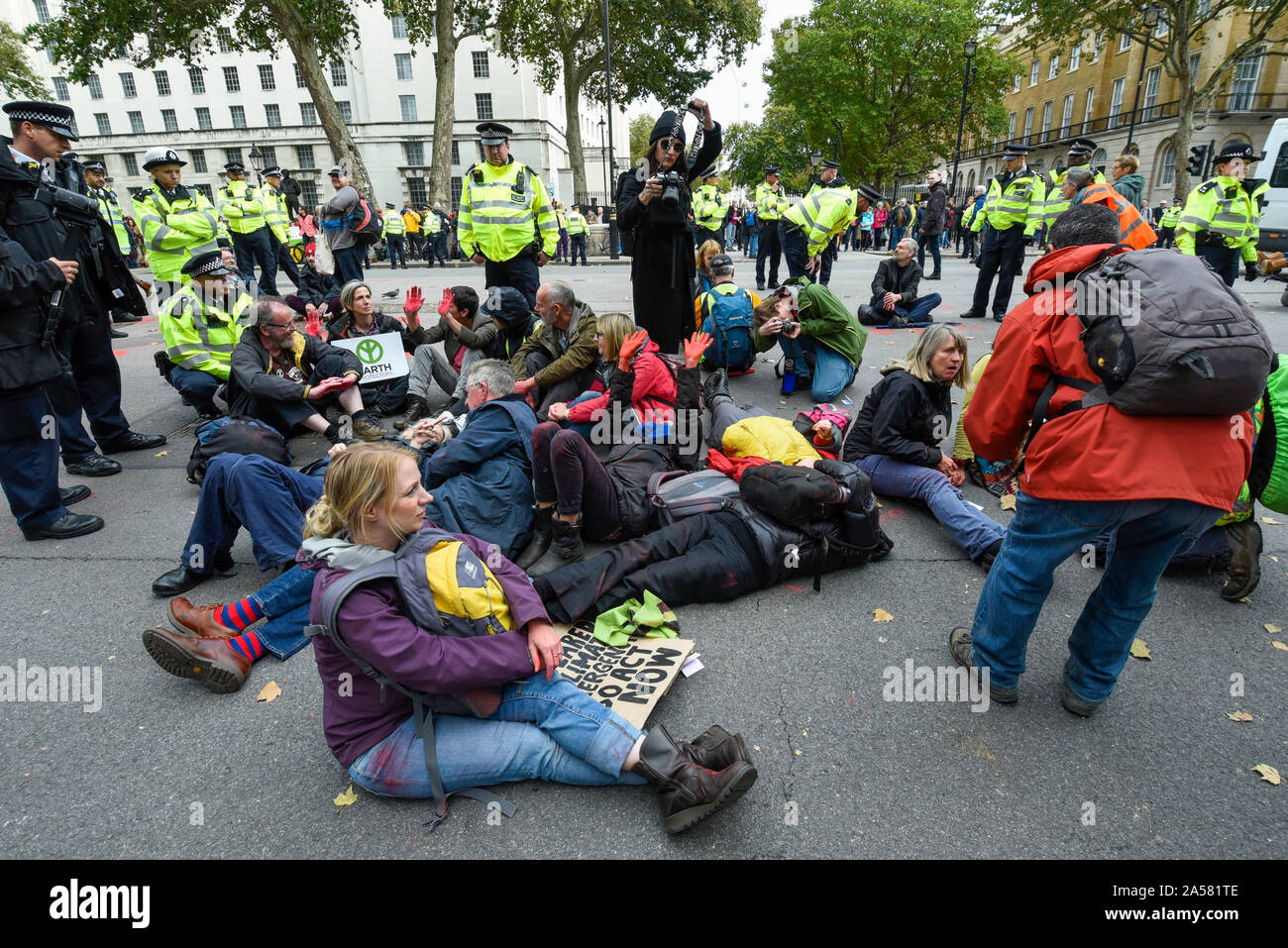 London, UK.  18 October 2019.  Climate activists from Extinction Rebellion protest outside Downing Street.  Activists are calling on the government to take immediate action on the negative effects of climate change.  Credit: Stephen Chung / Alamy Live News Stock Photo