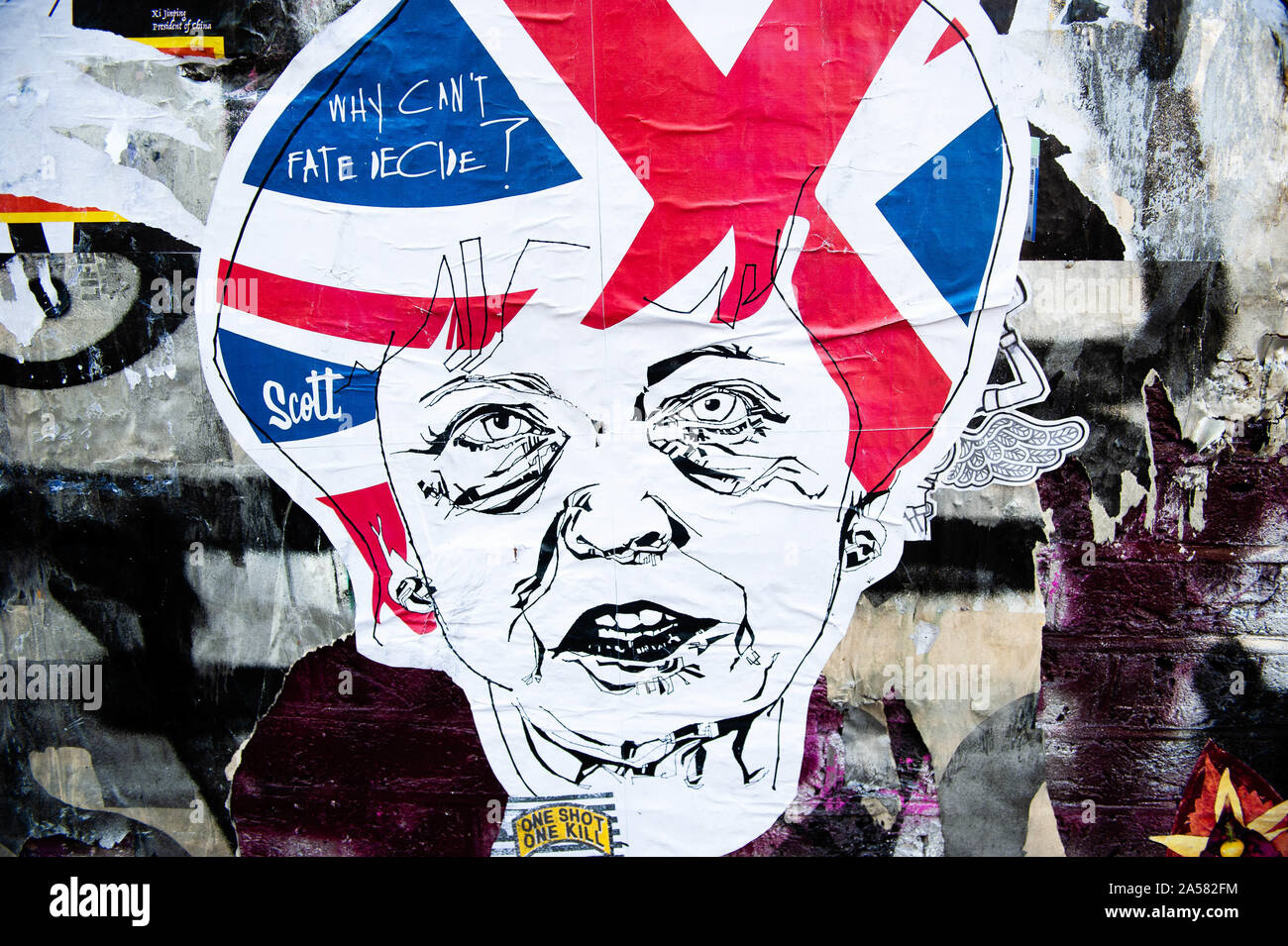 London, UK. 18th Oct, 2019. A sticker of Theresa May is seen on a wall.As the Brexit deadline looms, new murals and paste-ups appear on the streets of London. Brick Lane, in London's east end, is one of the most popular places to find all kind of art around the Brexit. Also in the famous district of Shoreditch, tourists walk and take photos around this political street art. Credit: Ana Fernandez/SOPA Images/ZUMA Wire/Alamy Live News Stock Photo