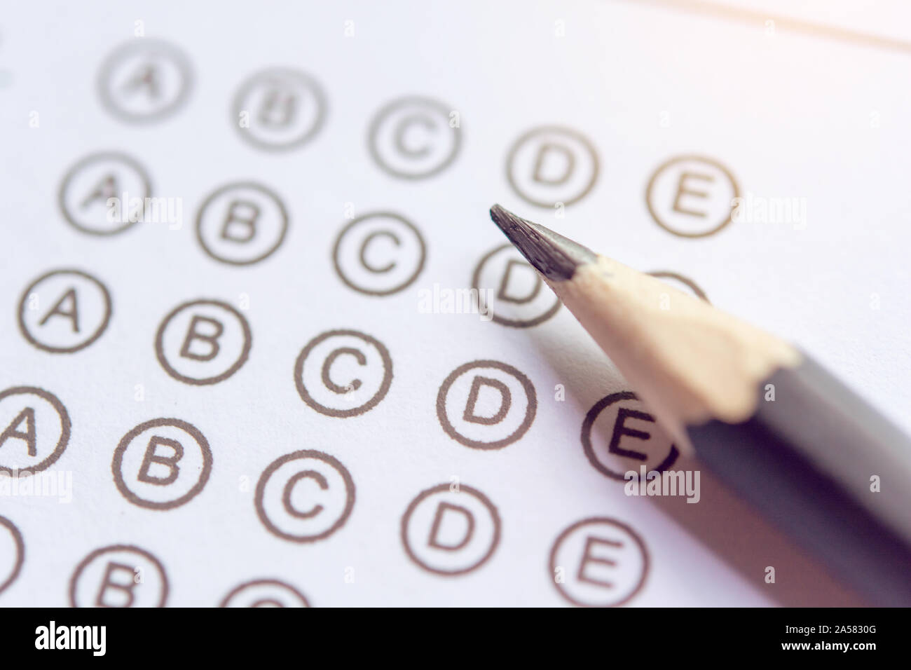 Pencil on answer sheets or Standardized test form with answers bubbled