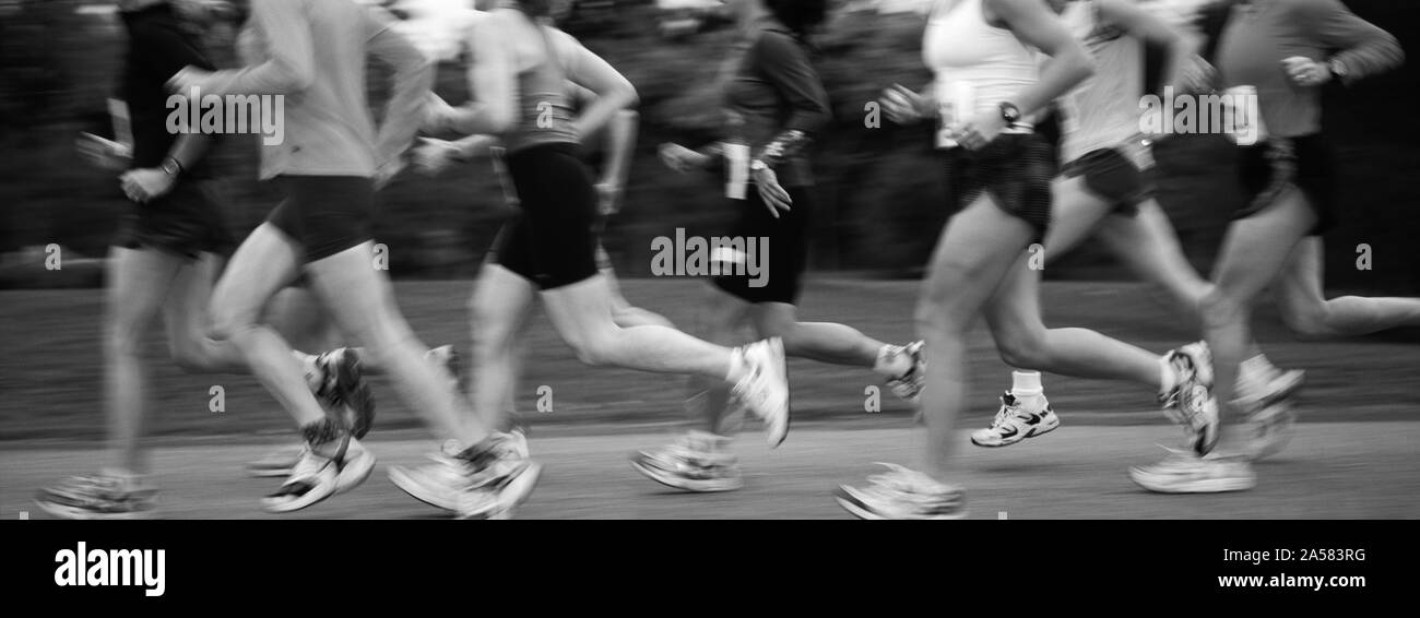 Side view of group of athletes running during competition Stock Photo