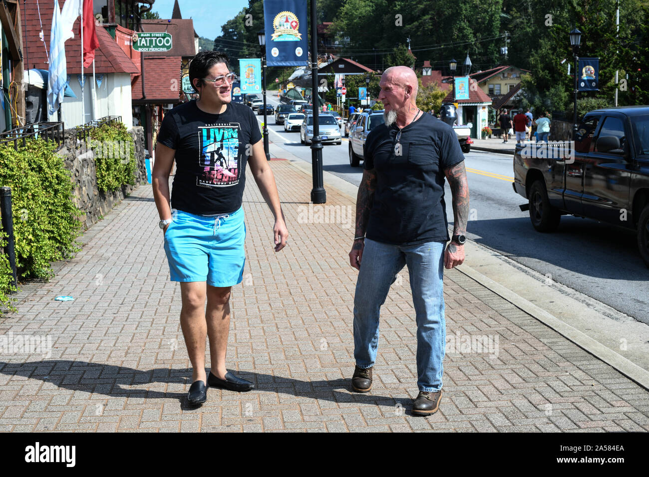 Dahlonega, Georgia, USA. 15th Sep, 2019. On right, Chester Doles, a self-declared white nationalist who said he shares '95 percent'' of Trump's agenda, walks with fellow withe nationalist Jovi Val at main street Helena, Ga, a Bavarian tourist town popular with exiled-Nazis in the 1950s and more recently, Doles and his colleagues. Credit: Miguel Juarez Lugo/ZUMA Wire/Alamy Live News Stock Photo