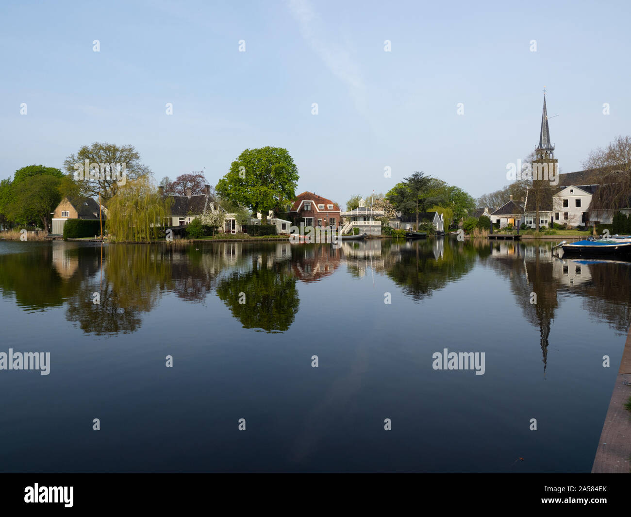 Buildings in old town of Broek in Waterland reflecting in water, North Holland, Netherlands Stock Photo