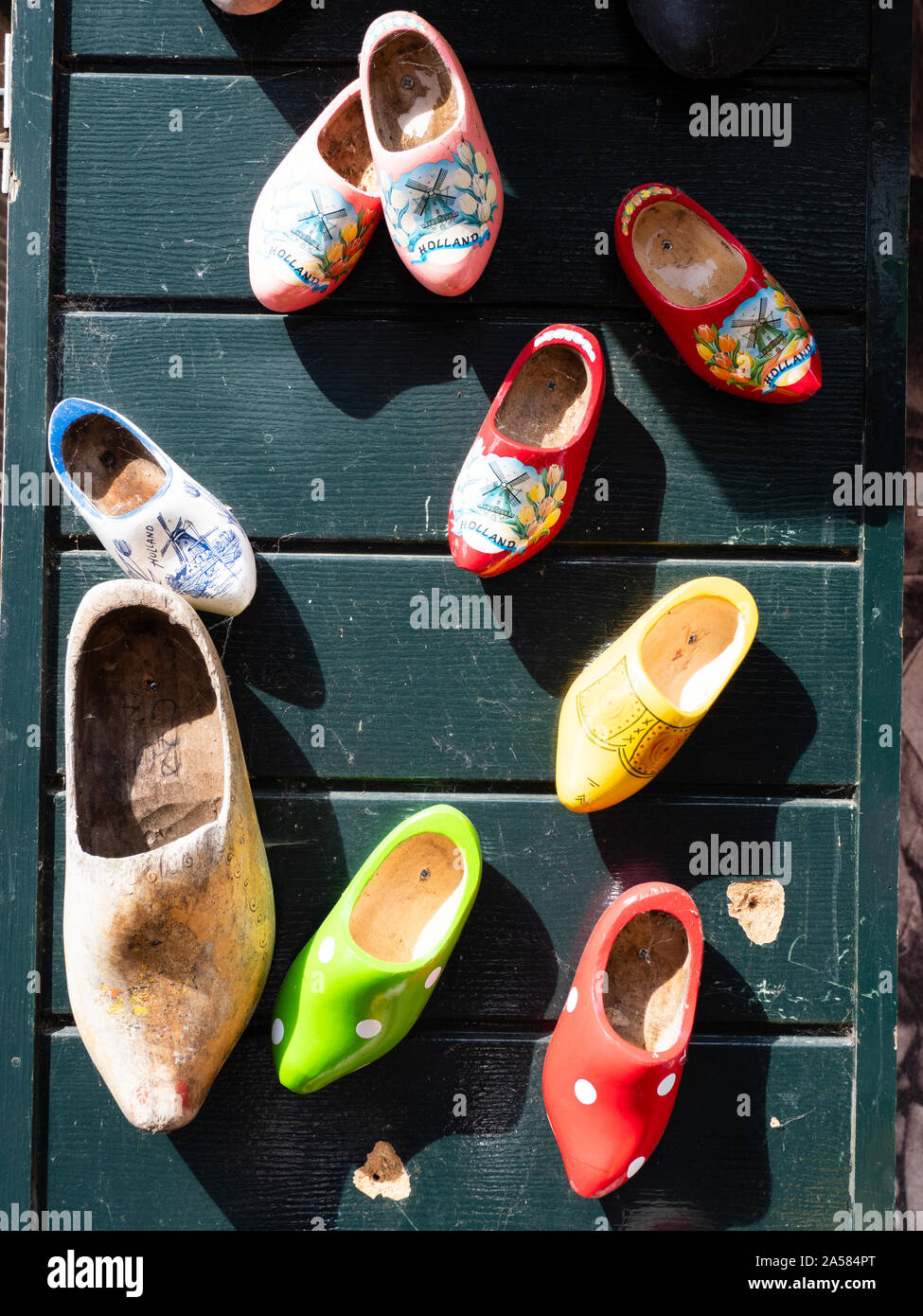 Traditional Dutch wooden clogs hanging on wall, Moonickendam, North Holland, Netherlands Stock Photo