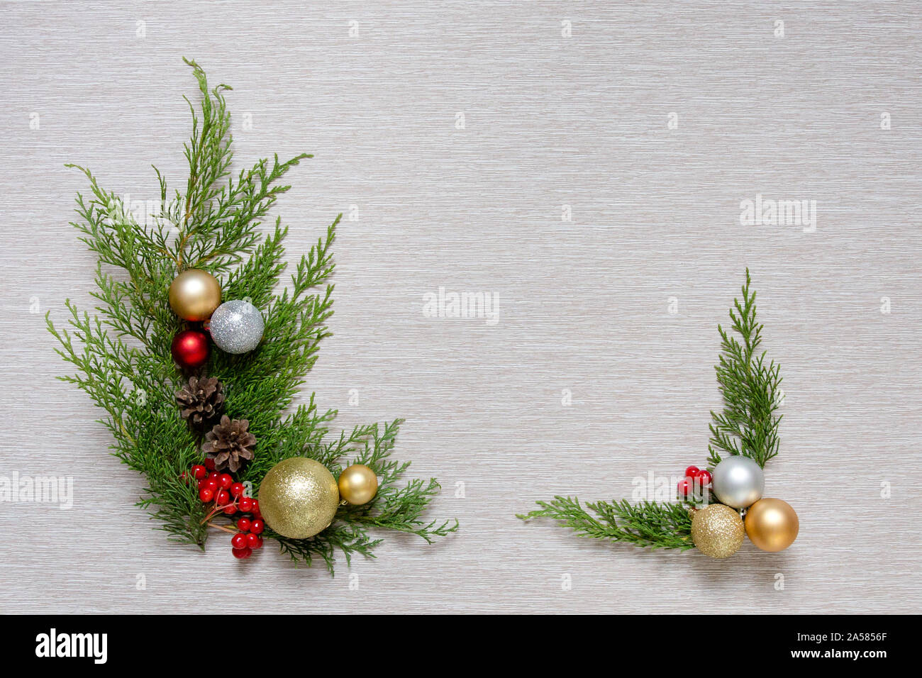Christmas wooden background with fir branches and balls. New Year's decoration. Stock Photo