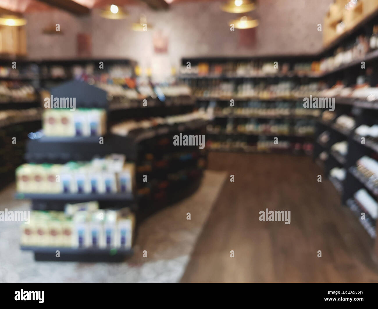 Blurred wine shop background. Liquor supermarket retail interior Stock Photo