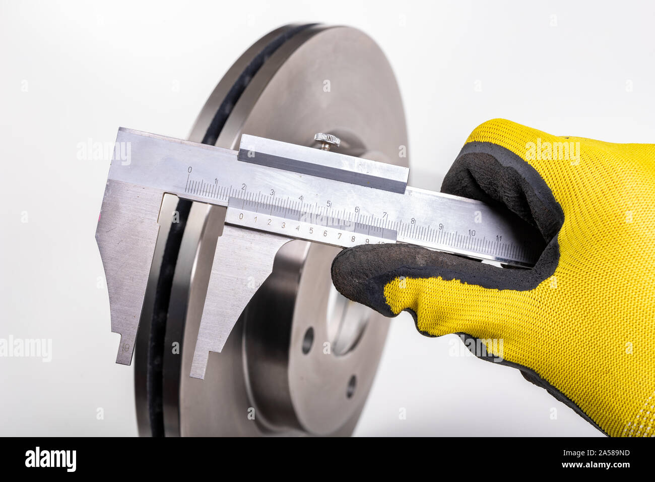 Measuring brake discs with a caliper. Car parts measurements