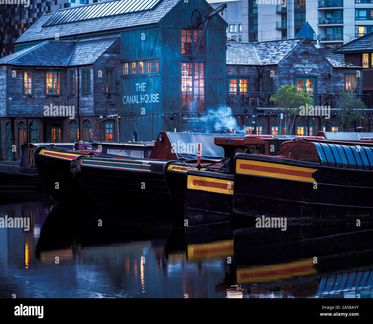 The Canal House restaurant and bar, Birmingham City Centre with narrowboats on Birmingham Old Canal Line (Gas St) moored in the foreground. Stock Photo