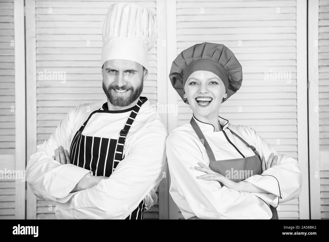 Kitchen boss. secret ingredient by recipe. cook uniform. man and woman chef in restaurant. Family cooking. Menu planning. culinary cuisine. couple in love with perfect food. Is under control. Stock Photo