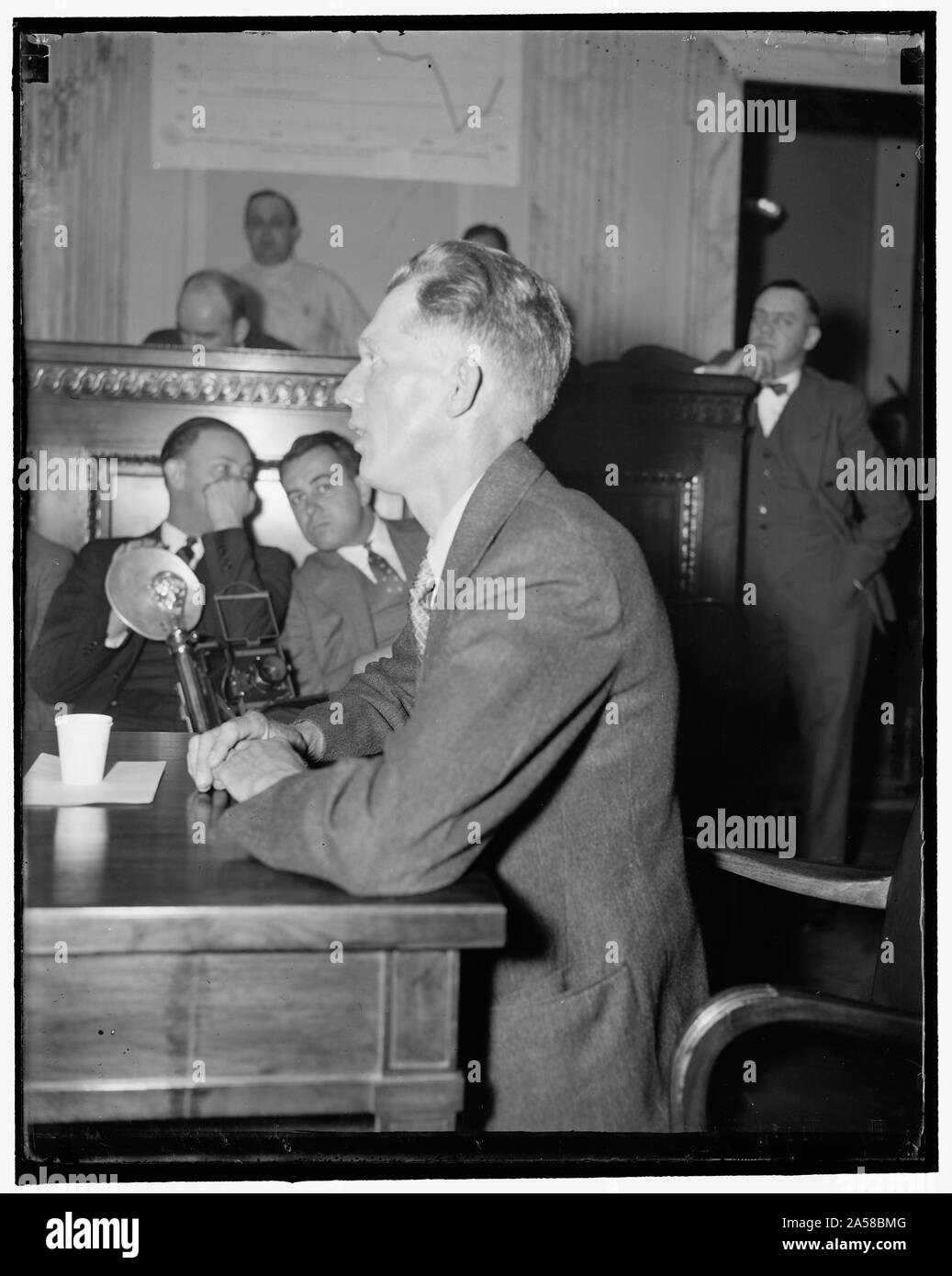 UMW worker before Civil Liberties. Washington, D.C., April 21. James Westmoreland from Harlan County, Ky., appeared before the Civil Liberties Committee at the Capitol and told how the Harlan County Coal Company had discharged men, approximately 75 men, for union activity. Westmoreland also said company police guarded his home and at one time ran his sister-in-law out of my home by warning her that she had better leave the house, 4/21/1937 Stock Photo