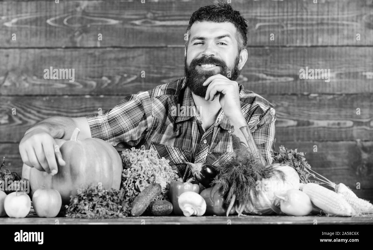 harvest festival. seasonal vitamin food. Useful fruit and vegetable. man chef with rich autumn crop. organic and natural food. happy halloween. bearded mature farmer. harvest festival concept. Stock Photo