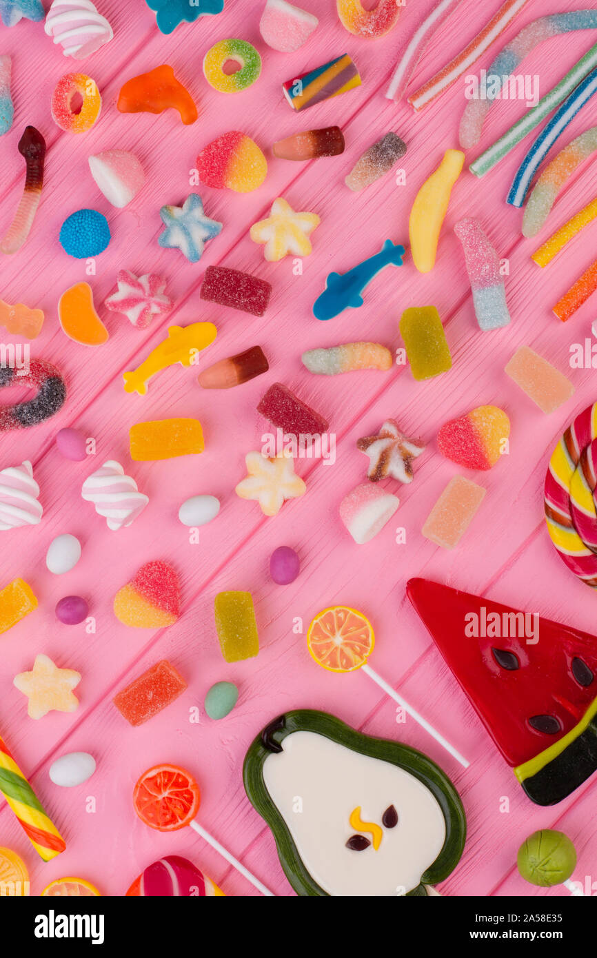 Color background with assorted sweets, top view Stock Photo - Alamy