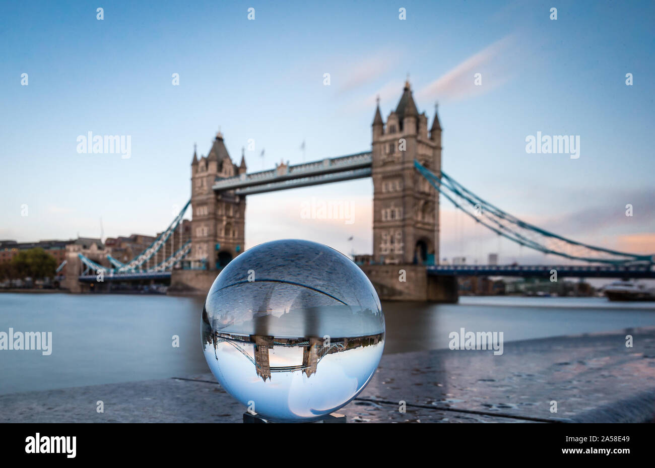 The iconic landmark of Tower Bridge seen through a crystal ball. Stock Photo