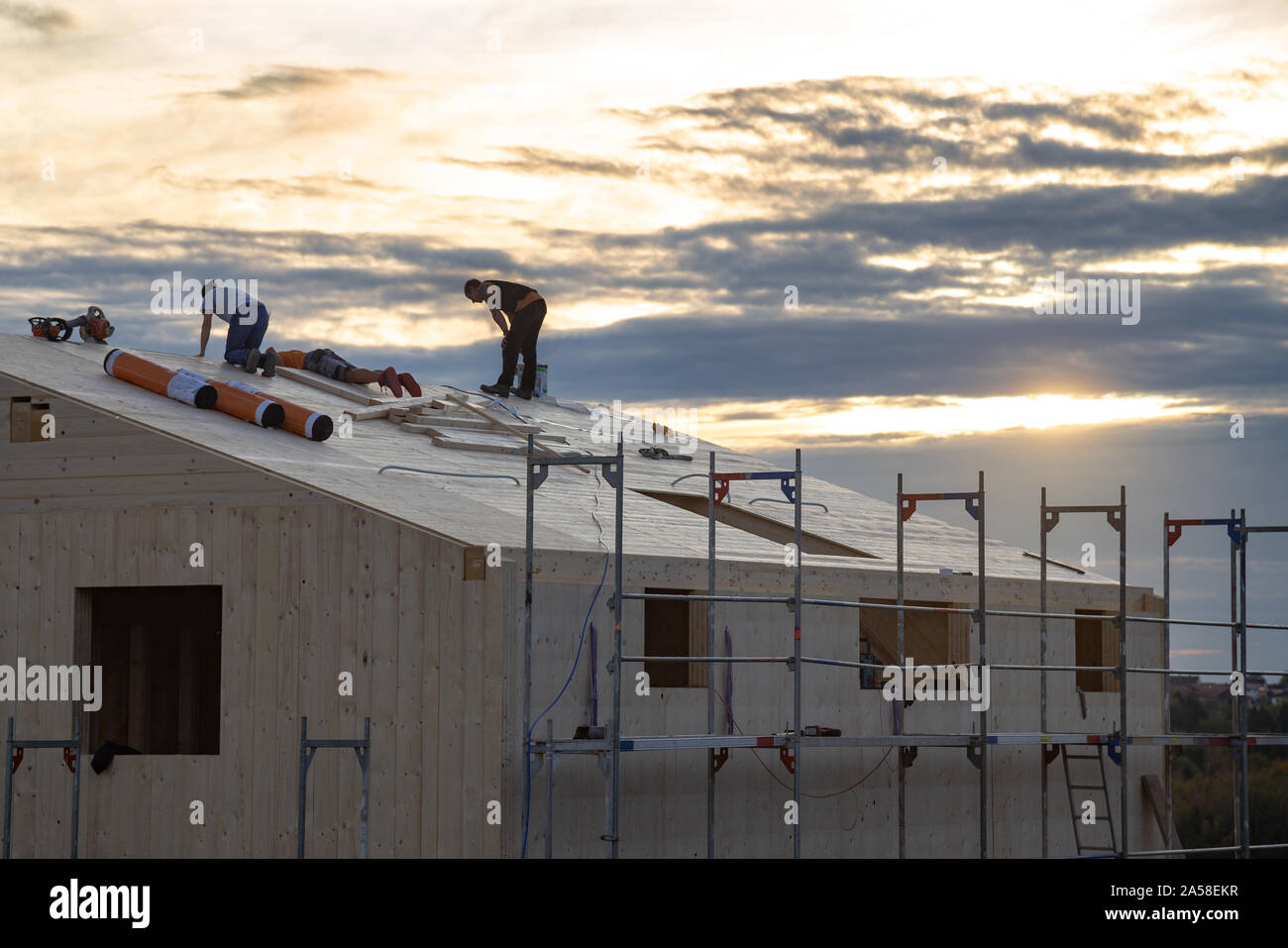 Carpenters at work on a new house under construction Stock Photo