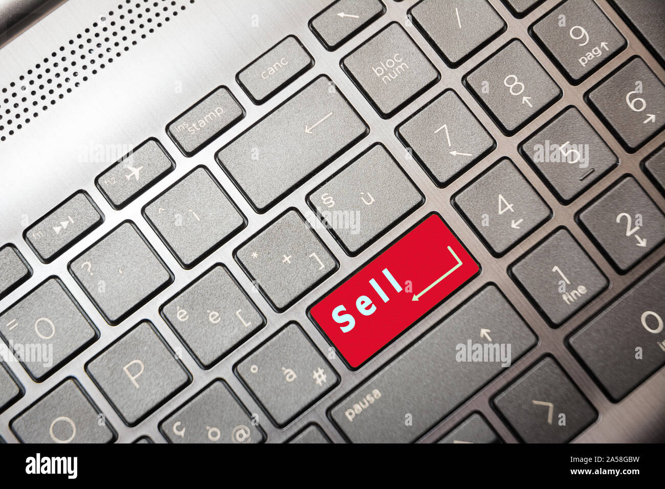 Red button on the computer with the text Sell Stock Photo