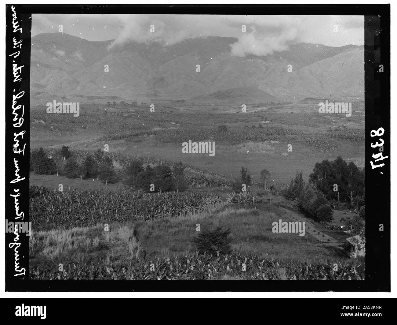 Uganda. Ruwenzori Range. Mountains of the Moon, from Fort Portal, telephoto, showing hotel Uganda. Ruwenzori Range. Mountains of the Moon, from Fort Portal, telephoto, showing hotel
