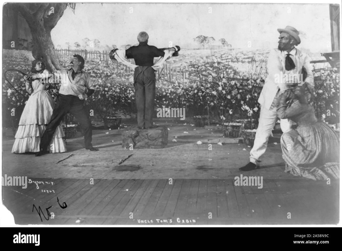 Uncle Tom at the whipping post Wilton Lackaye (center, as Uncle Tom) and Theodore Roberts (right, as Simon Legree) Stock Photo