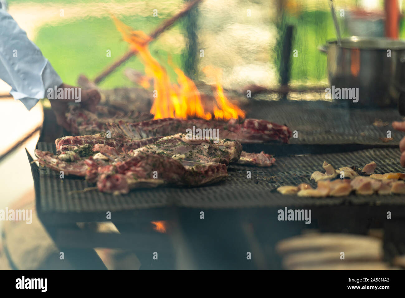 Cook turns grill meat on hi-res stock photography and images - Alamy
