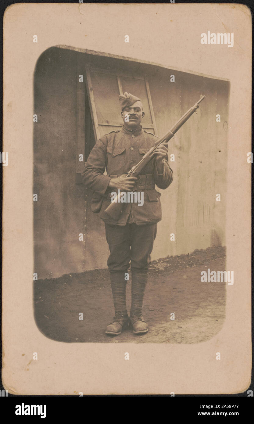 Unidentified African American soldier in uniform, cartridge belt, and ...