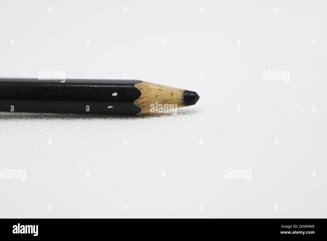 Black pencil placed on the table Stock Photo