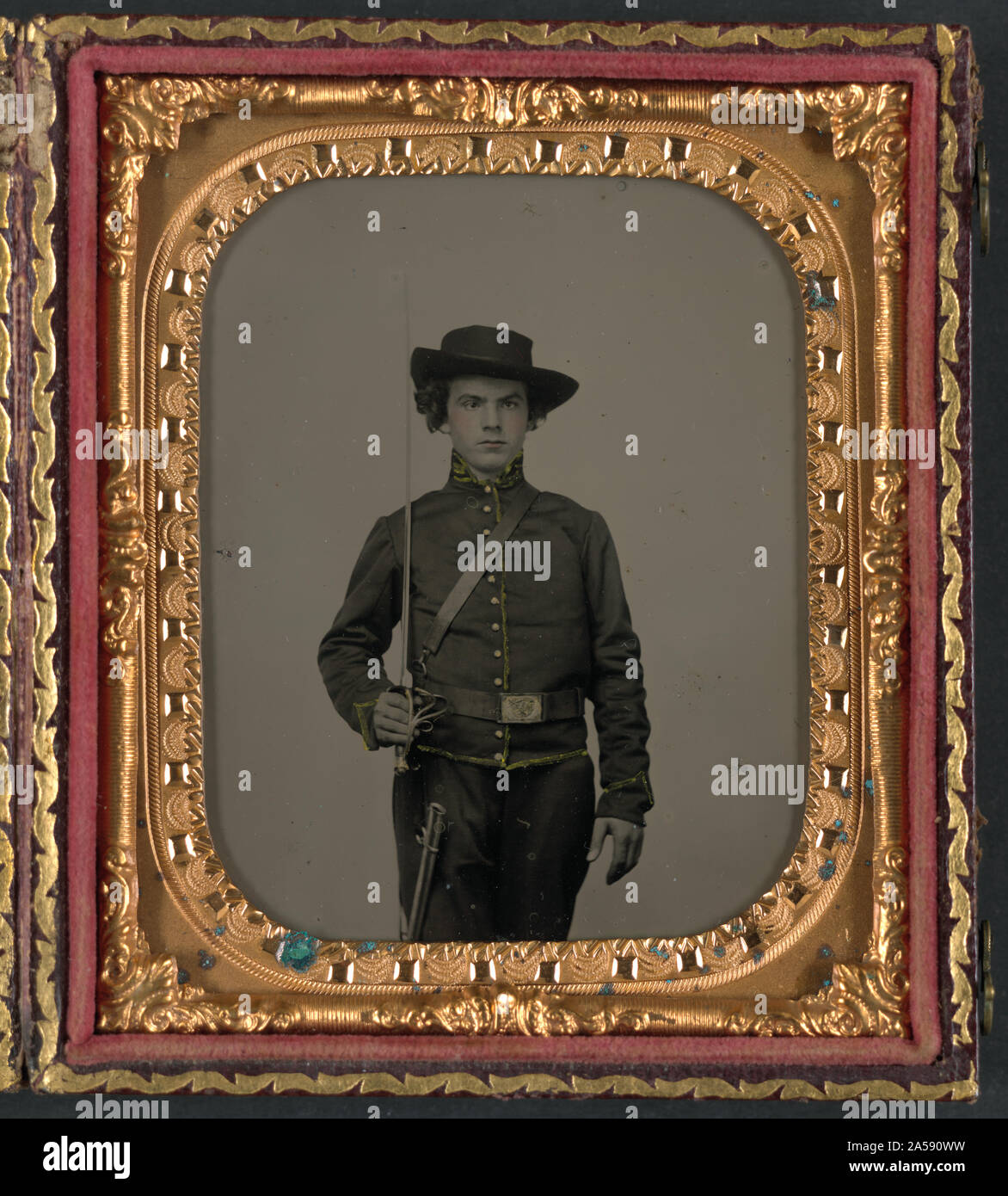 Unidentified soldier in Union uniform with cavalry saber and scabbard ...