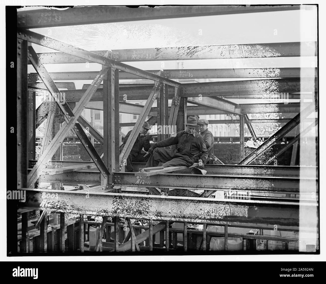 Unidentified workmen on steel beams Stock Photo Alamy