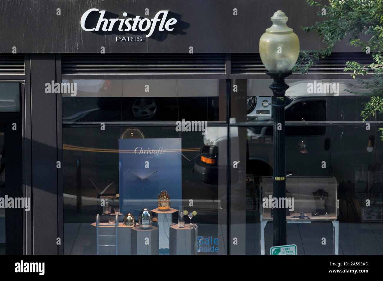 A logo sign outside of a Christofle retail store location in downtown ...