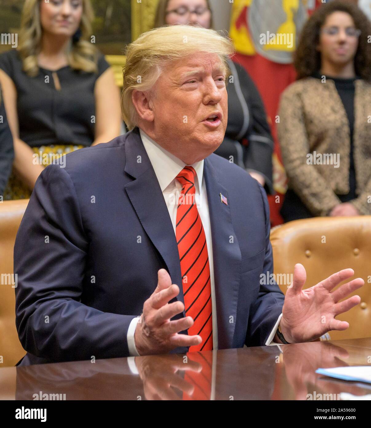 Washington, United States of America. 18 October, 2019. U.S. President Donald Trump speaks to astronauts Christina Koch and Jessica Meir by video-link prior to their all-woman spacewalk from the Roosevelt Room of the White House October 18, 2019 in Washington, DC. Credit: Bill Ingalls/NASA/Alamy Live News Stock Photo