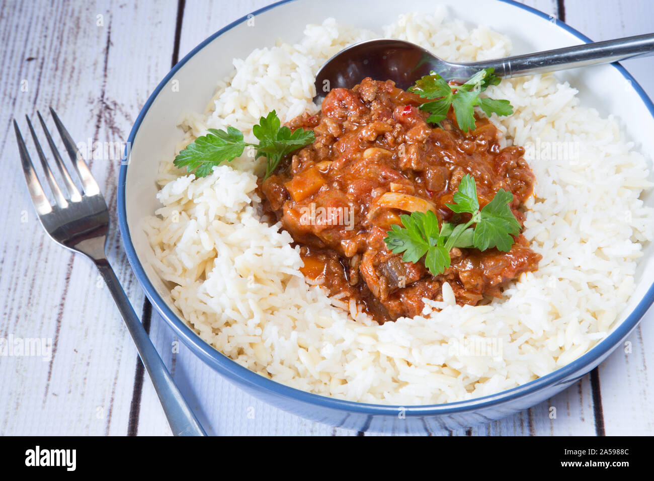 Quorn chili with rice and orzo pilaf Stock Photo