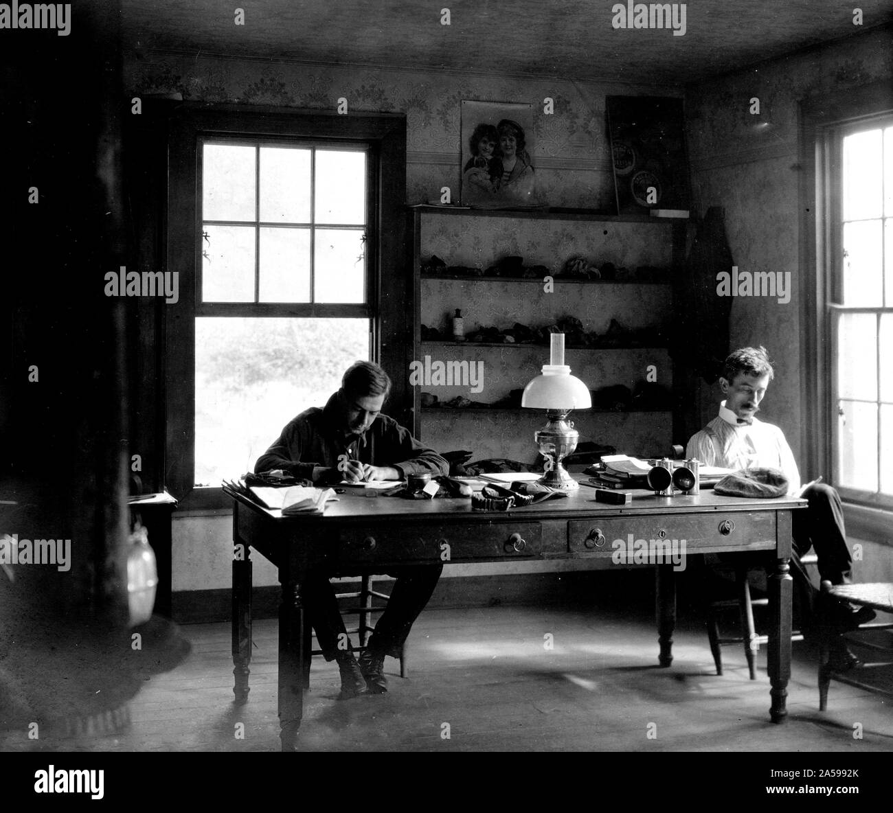 These gentleman geologists are hard at work in their field office going  over their field notes. This photo was taken in 1903 in Crab Orchard, Lee  County, Virginia Stock Photo - Alamy