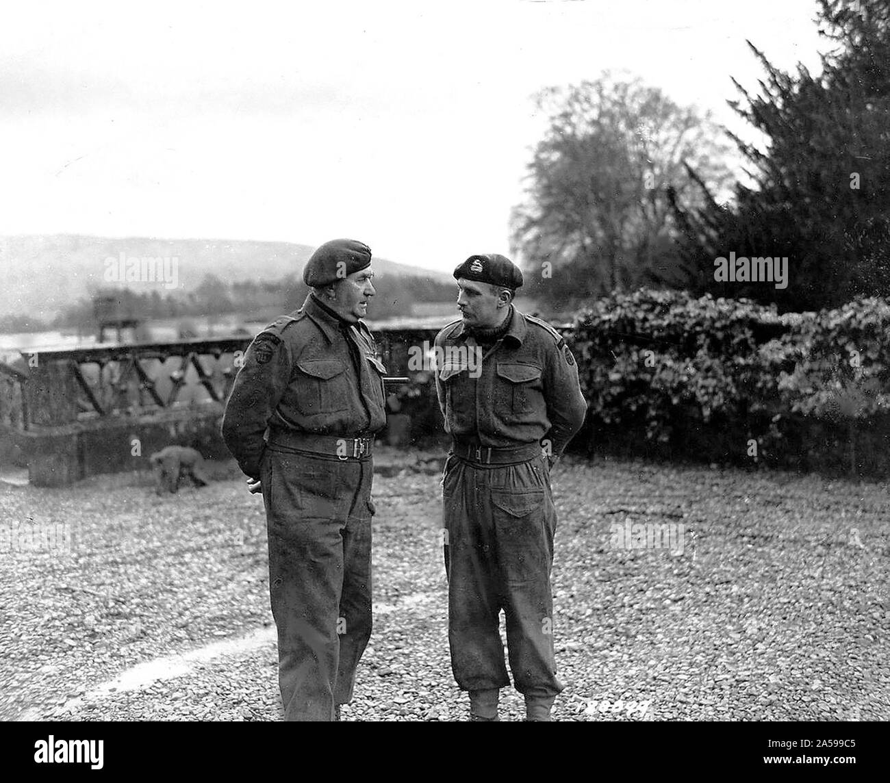 Lt. Col. Vaughan, Commander of a Commando Depot , confers with his ...