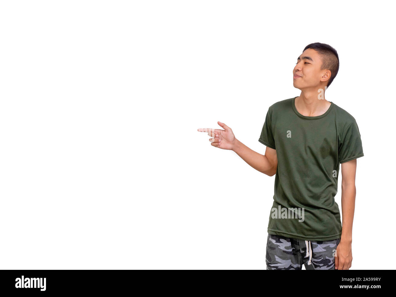 The Young Thai man points to his right side copyspace. Stock Photo