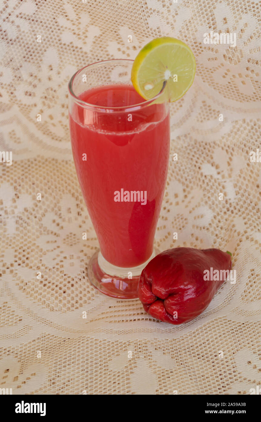 Otaheite Apple And Juice Garnished With Lime Stock Photo