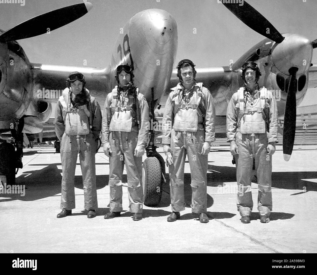 The Aircraft Engine Research Laboratory’s pilot corps during the final days of World War II: from left to right, Joseph Vensel, Howard Lilly, William Swann, and Joseph Walker. William “Eb” Gough joined the group months after this photograph. These men were responsible for flying the various National Advisory Committee for Aeronautics (NACA) aircraft to test new engine modifications, study ice buildup, and determine fuel performance. Stock Photo
