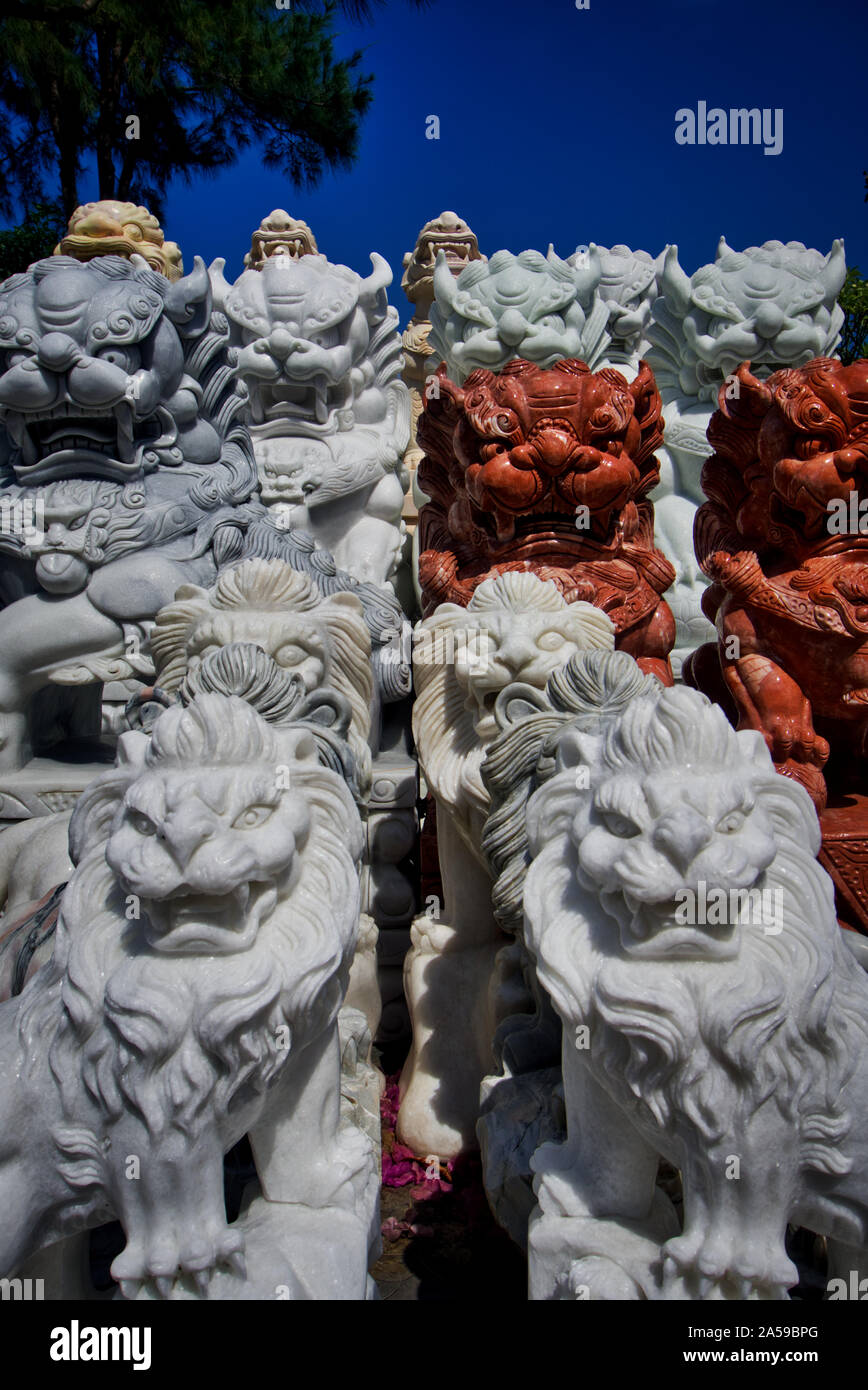 Many stone lions looking. Stone and rock carvings from central Vietnam. Sculpture and skilled artisan work. Stock Photo